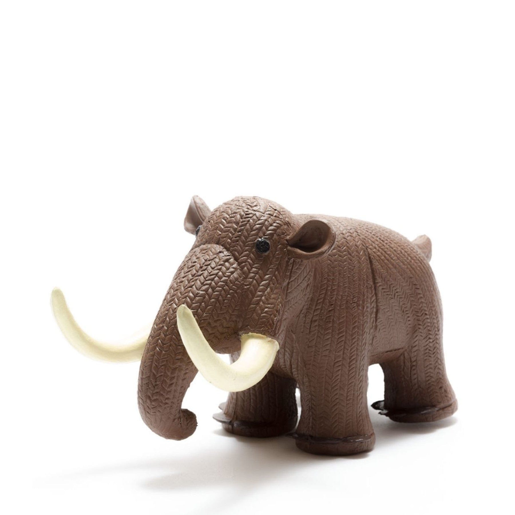 Brown toy elephant with ivory tusks on white background