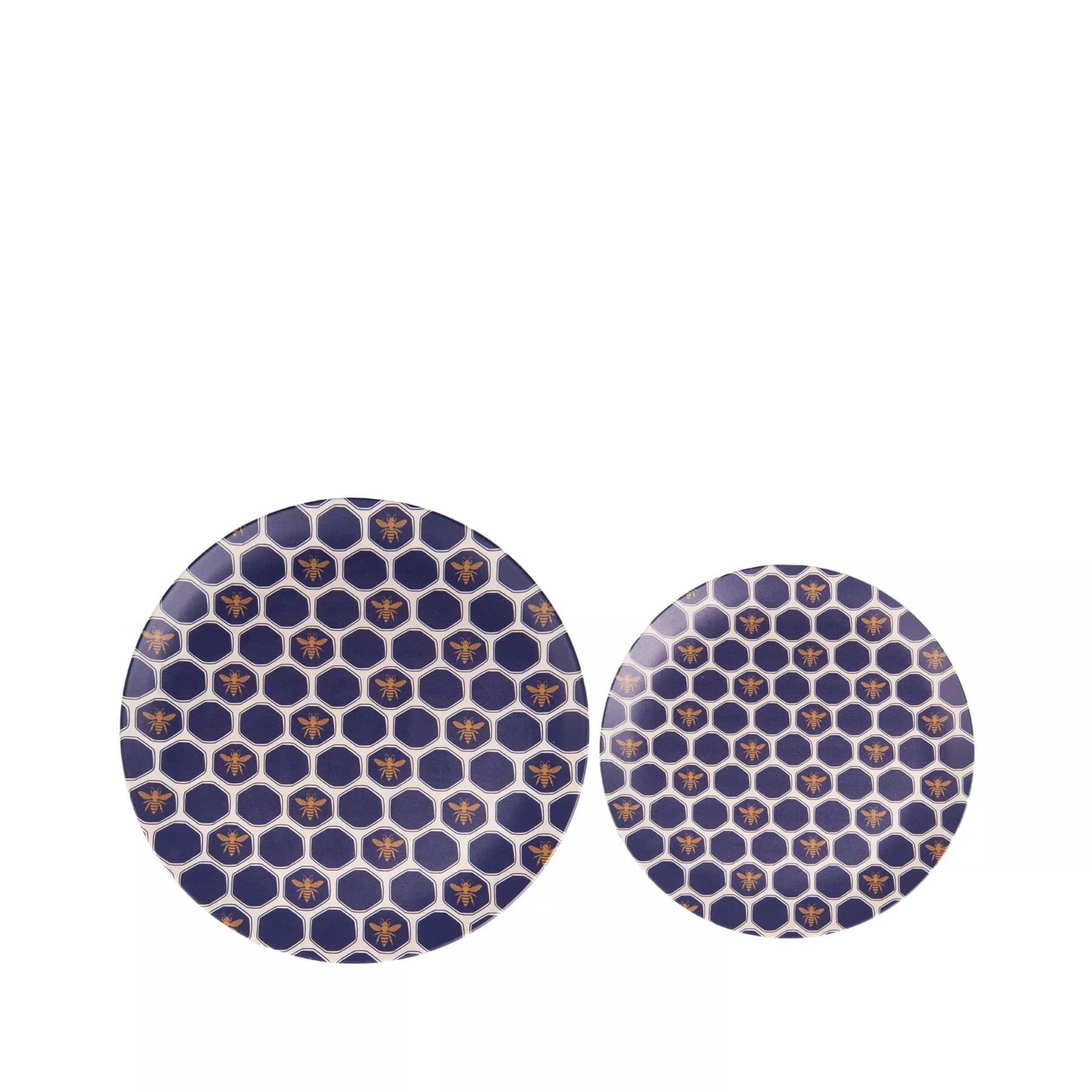 Two round ceramic plates with blue geometric pattern and gold accents isolated on white background