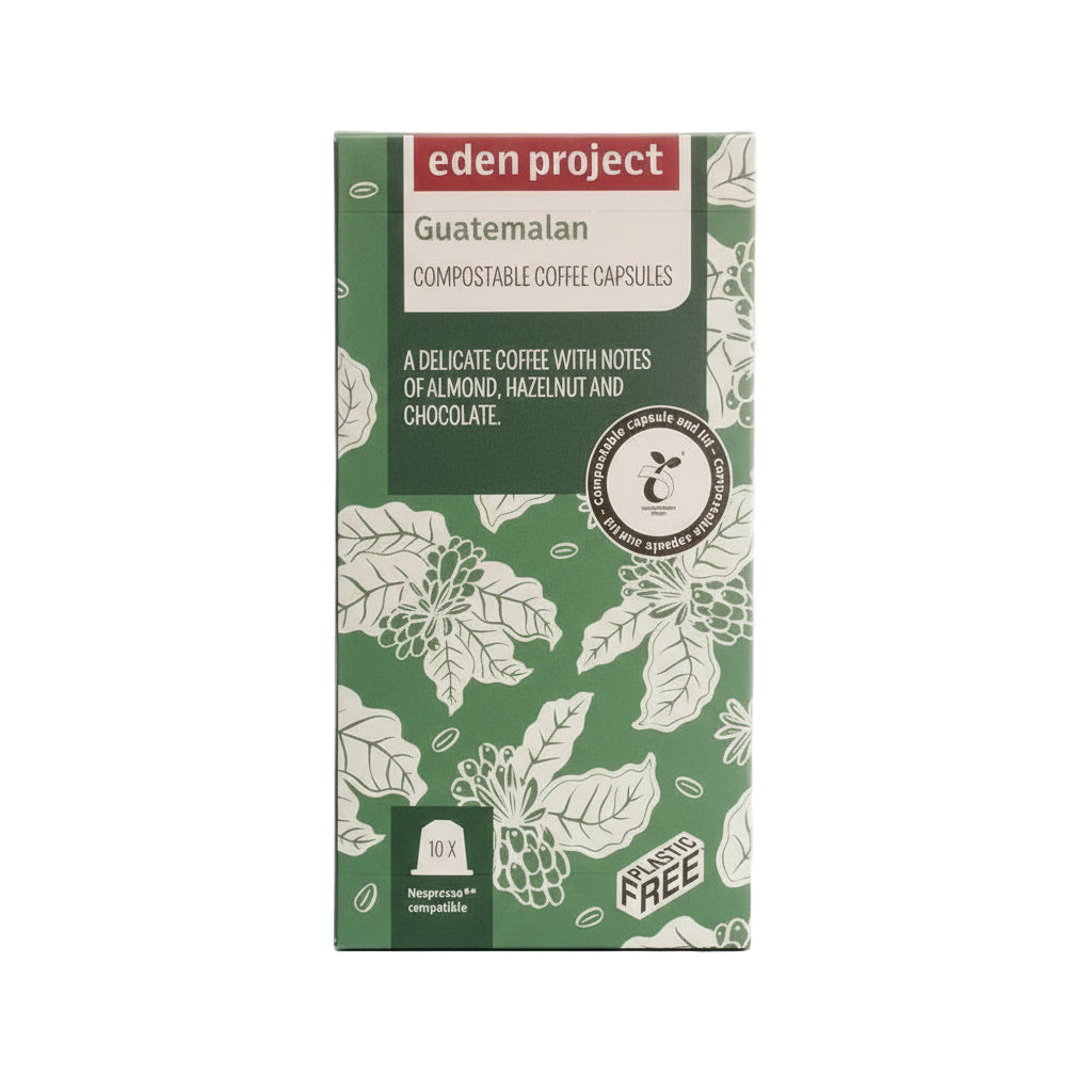 Alt text: Eden Project branded Guatemalan compostable coffee capsules packaging with green leafy design, indicating almond, hazelnut, and chocolate flavors, 10 Nespresso compatible pods highlighted, plastic-free.