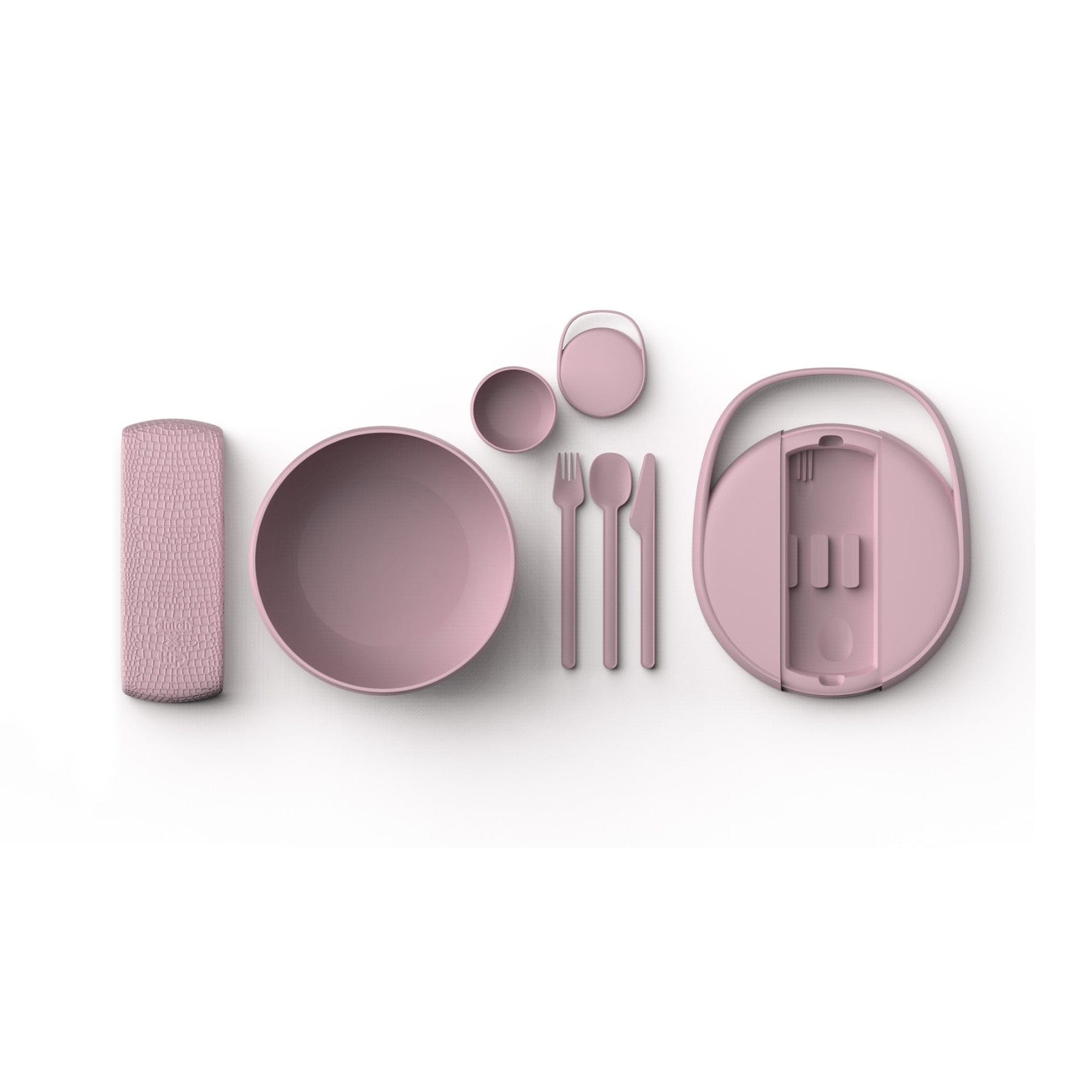 Modern pink dinnerware set with plates, bowl, cup, napkin, and cutlery including a fork, knife, and spoon on a white background.