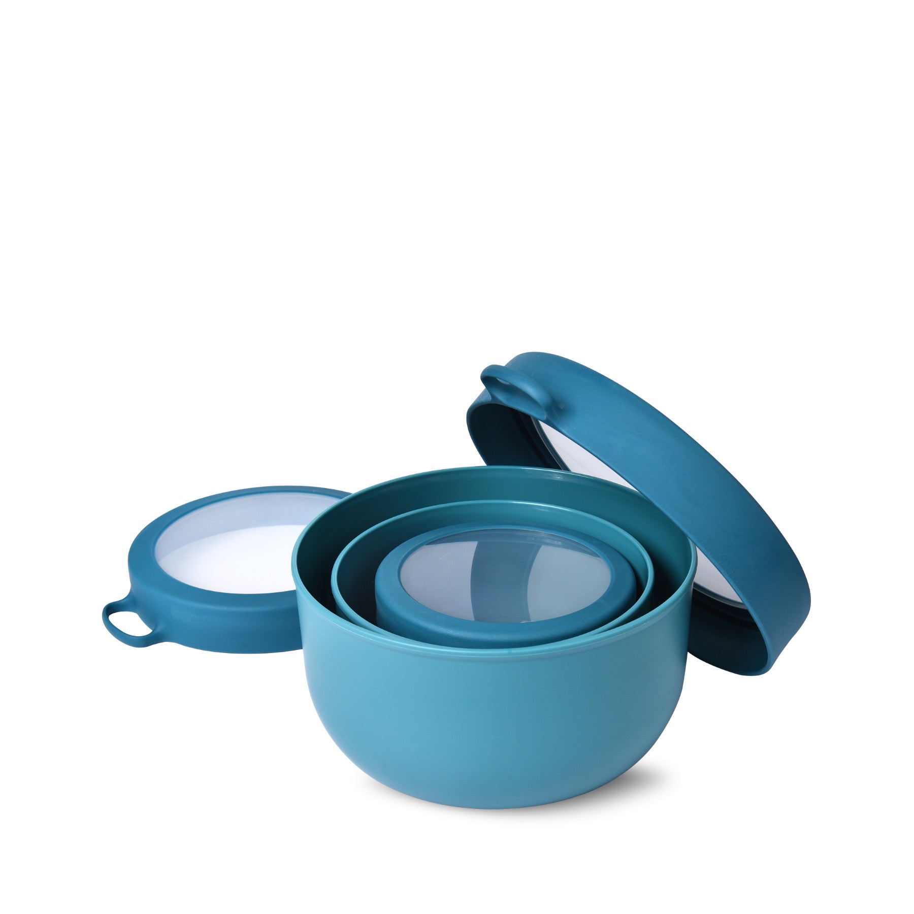 Blue nesting mixing bowls with lids on a white background
