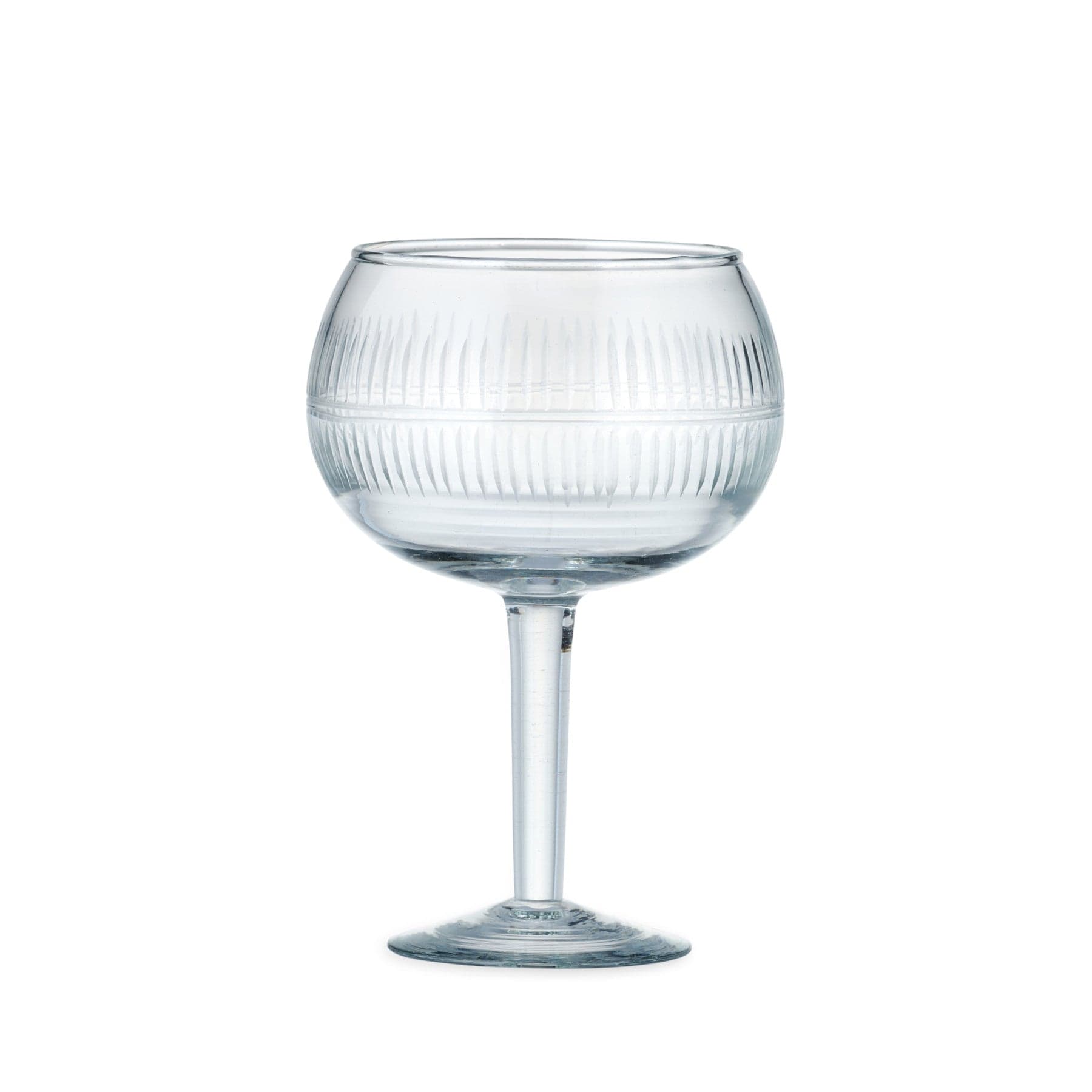 Empty ribbed glass goblet on white background