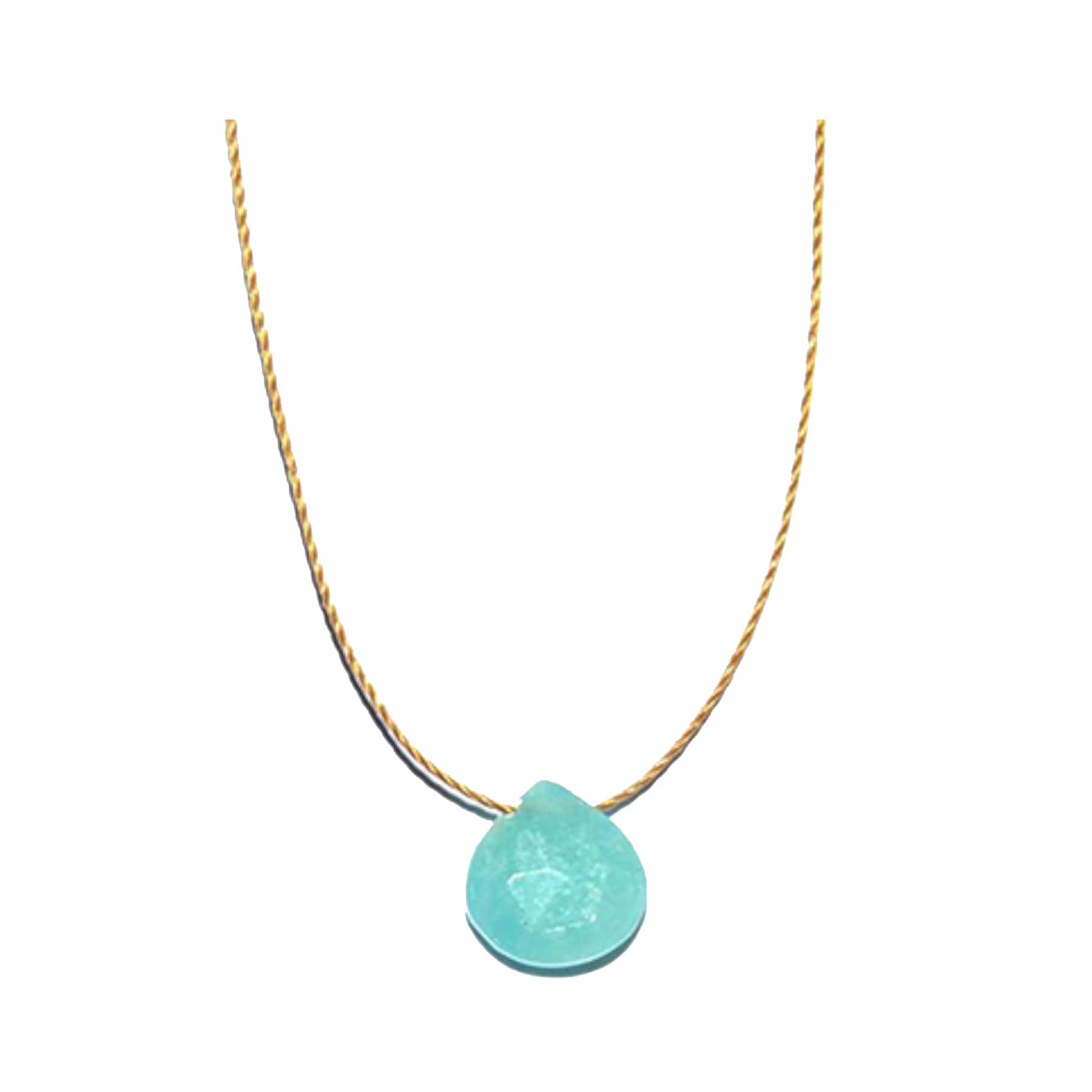 Gold necklace with a large aquamarine pendant on a white background.
