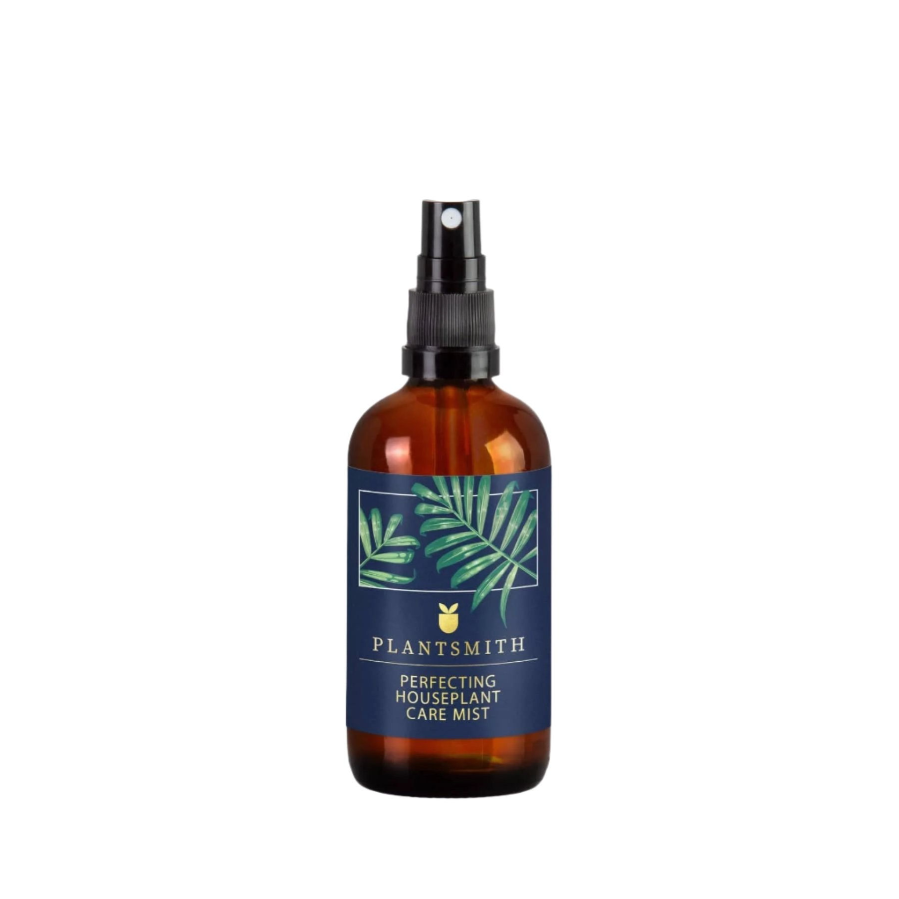 Amber glass bottle of PLANTSMITH Perfecting Houseplant Care Mist with spray nozzle and green leaf label design on a white background