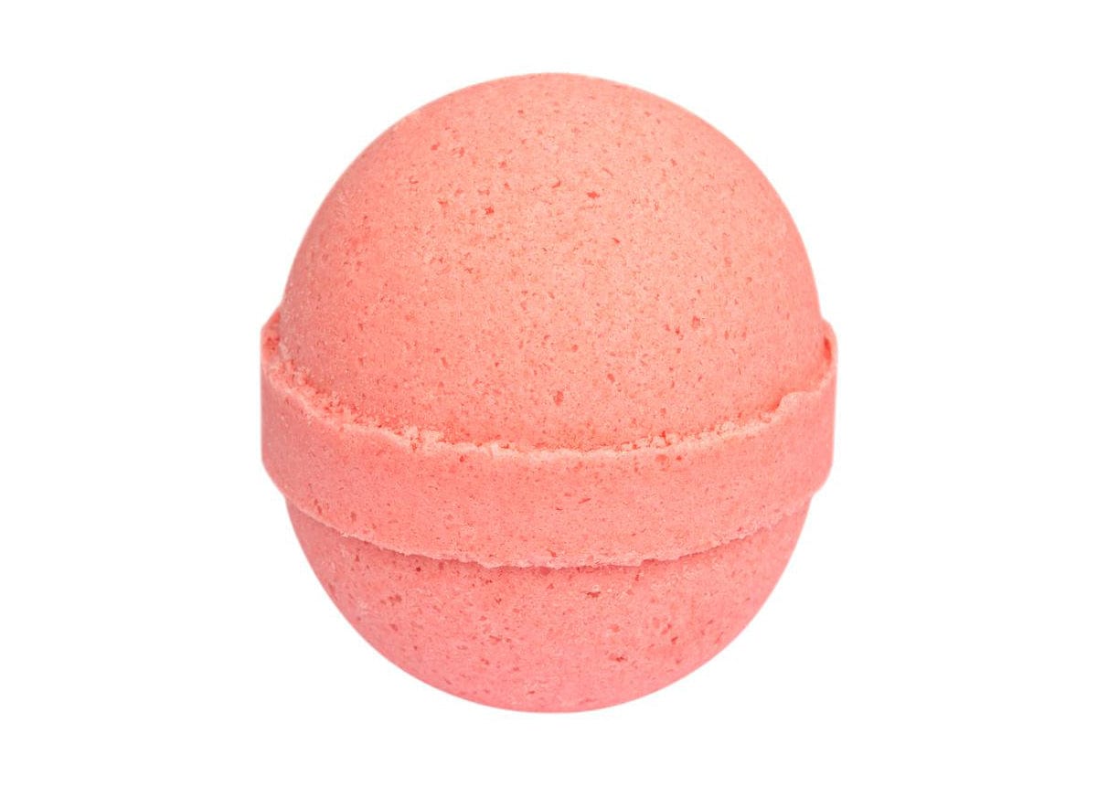 Pink bath bomb isolated on white background, round organic handmade spa fizzy bath ball, aromatherapy body care product, skincare wellness accessory.