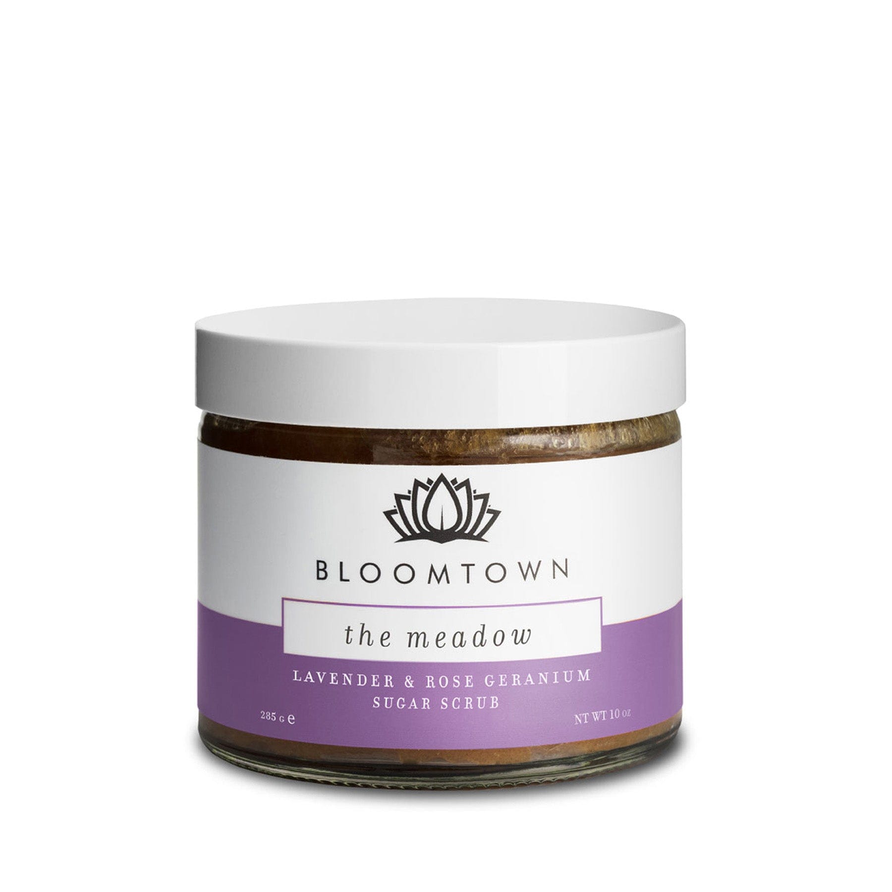 Bloomtown The Meadow Lavender & Rose Geranium Sugar Scrub in a glass jar with white and purple label on a white background.