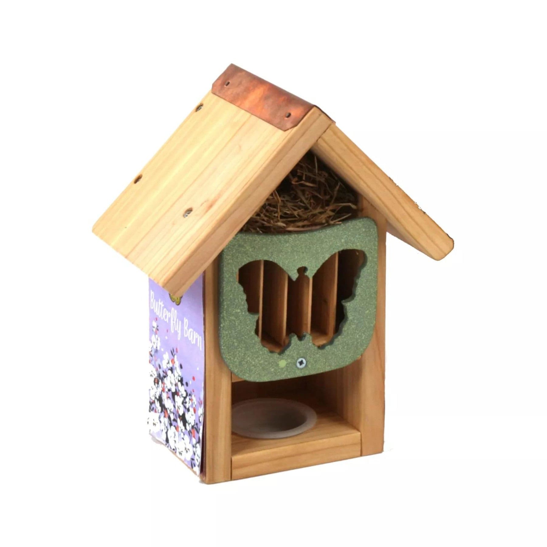 Wooden butterfly house with sloped roof, copper detailing, nesting material inside, and butterfly-shaped entrance on a white background.