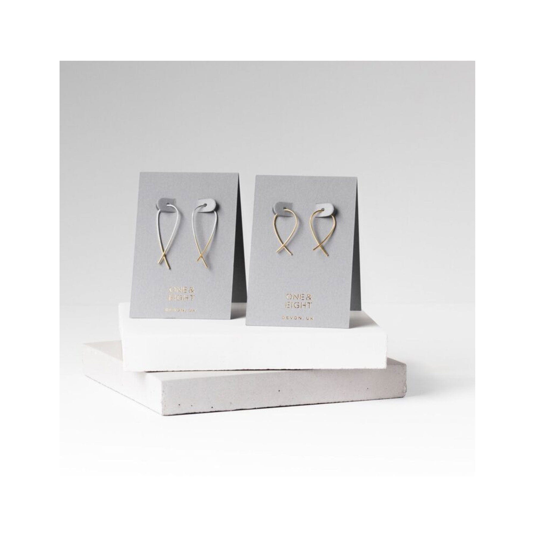 Silver cross over earrings gold dipped ends