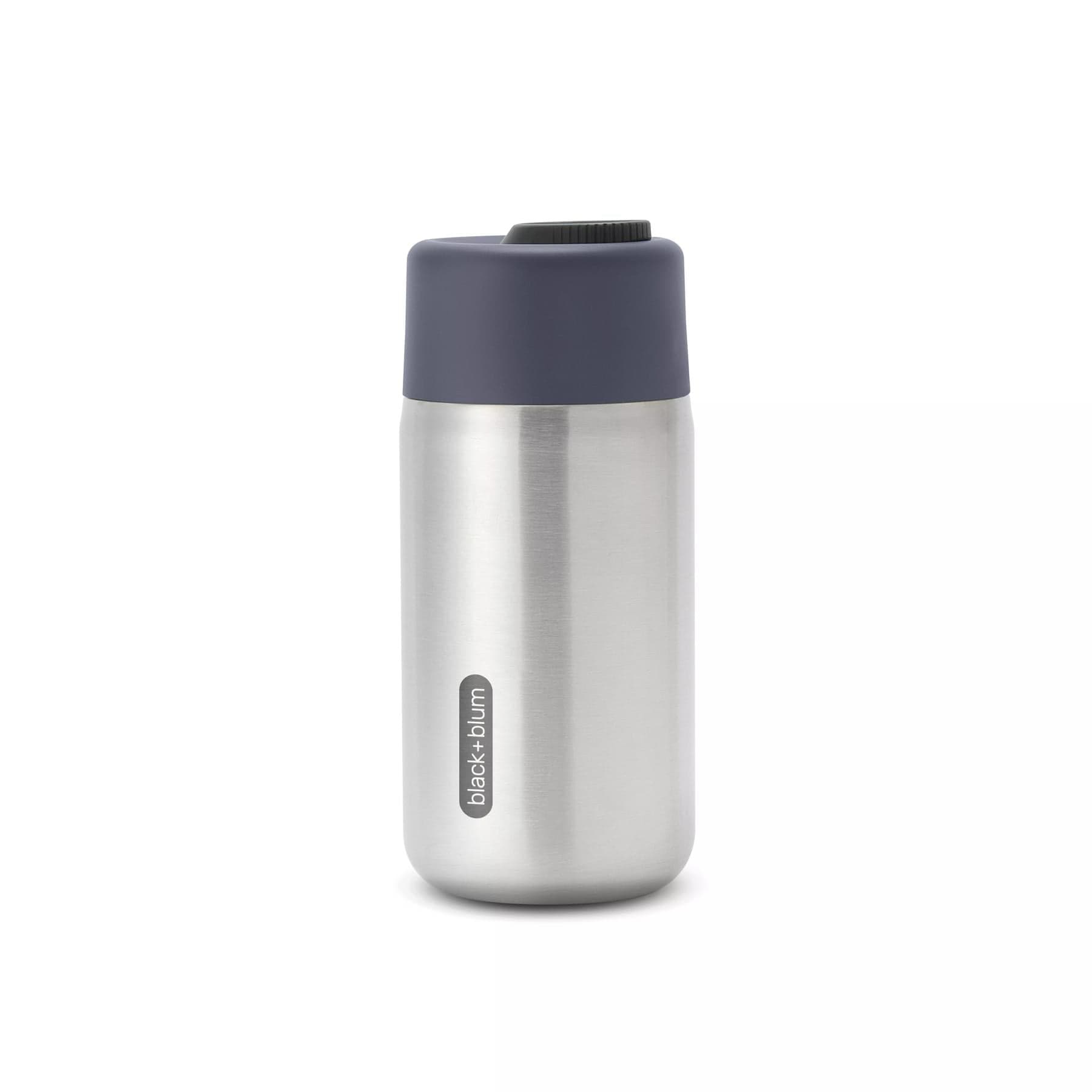 Stainless steel insulated travel mug with navy blue lid on white background.