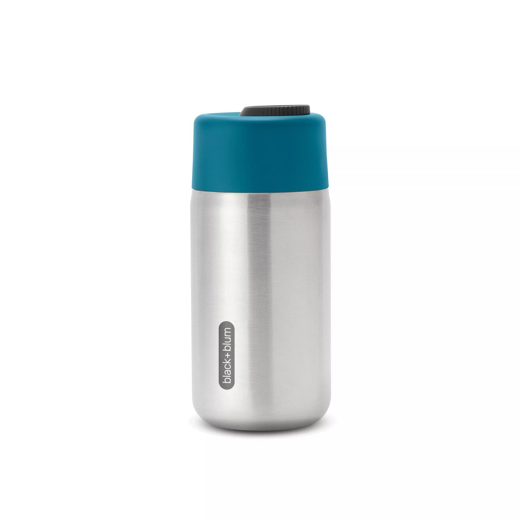Stainless steel insulated travel mug by Black+Blum with teal lid on white background