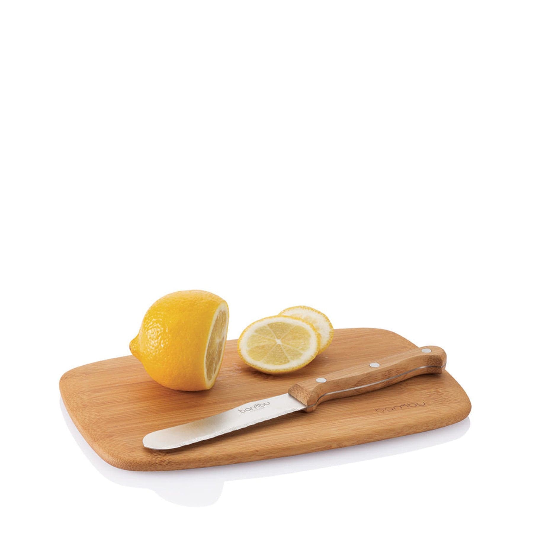 Fresh lemon halves on bamboo cutting board with stainless steel knife, kitchen preparation, isolated on white background