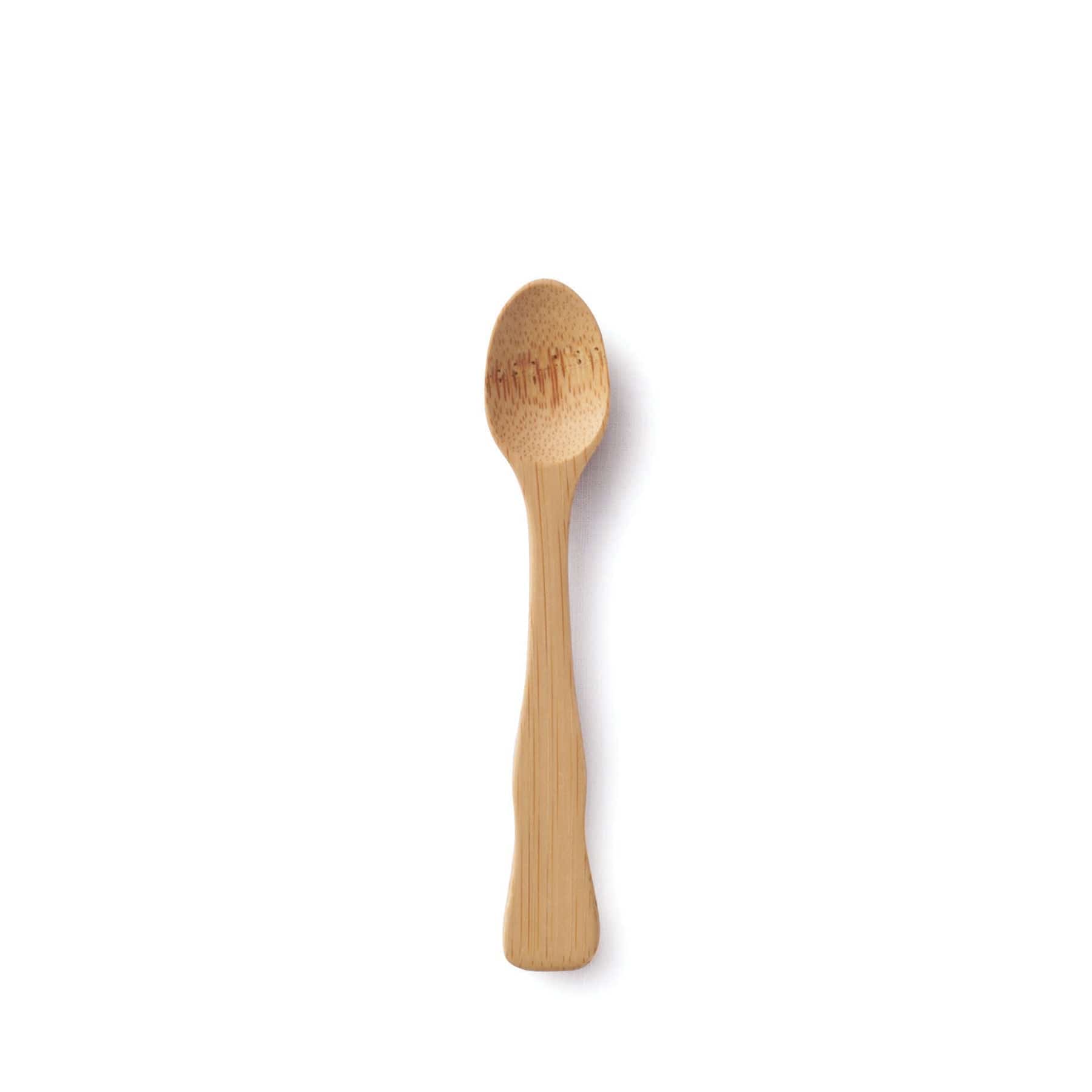 Wooden spoon on white background, top view, kitchen utensil, cooking tool, minimalist food preparation concept