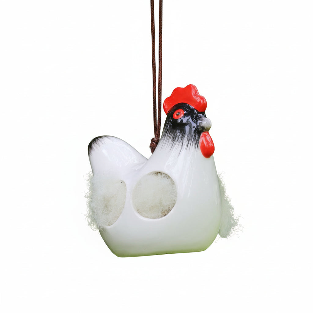 'Cluckie' hanging ceramic hen with nesting wool