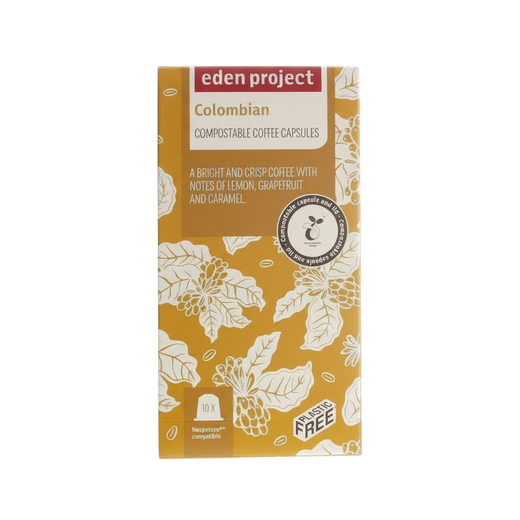 Eden Project Colombian compostable coffee capsules packaging with floral design, notes of lemon, grapefruit, and caramel, Nespresso compatible, plastic-free label.