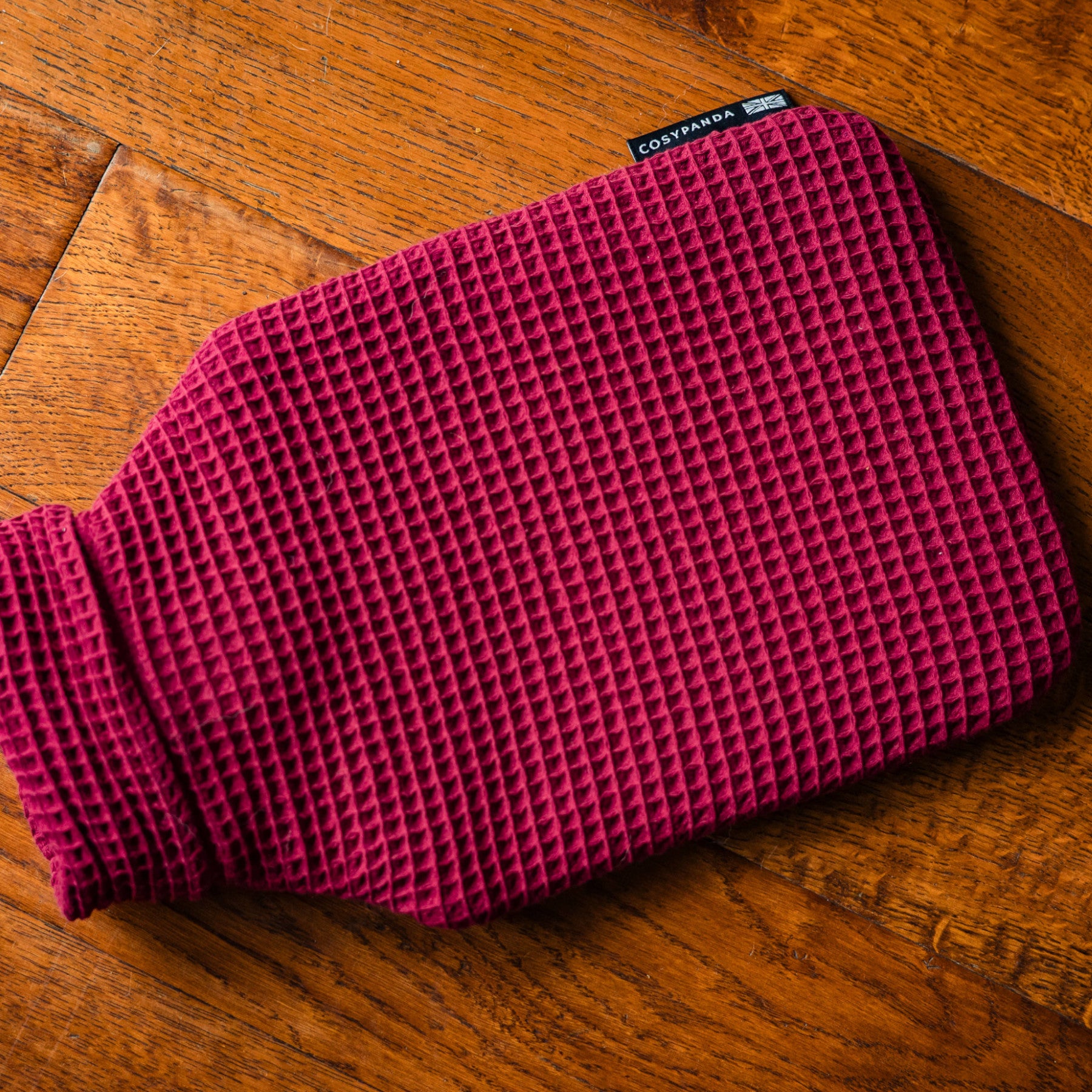 Ruby red luxurious waffle hot water bottle