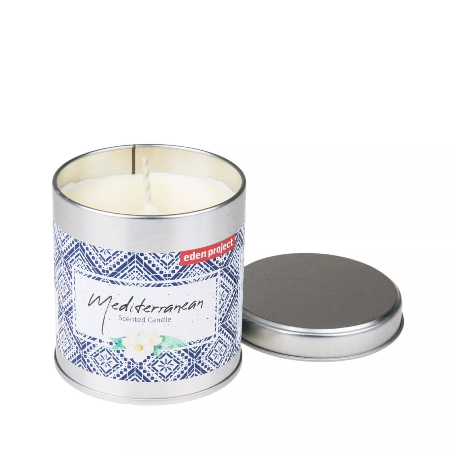 Mediterranean scented candle by Eden Project with white wax, single wick, decorative geometric pattern tin, and detached lid on white background.