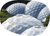 Geodesic domes with hexagonal pattern cladding at Eden Project, Cornwall, sustainable architecture, environmental conservation, botanical garden biodomes, eco-tourism attraction, futuristic structures, transparent biomes in landscape