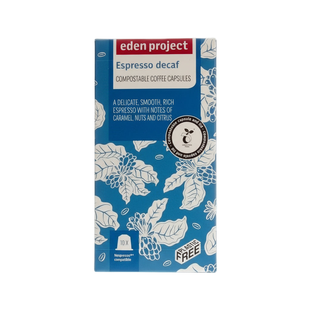 Eden Project compostable coffee capsules box, Espresso Decaf, eco-friendly Nespresso compatible pods packaging with floral design, caramel nuts citrus flavor notes, plastic-free initiative emblems.