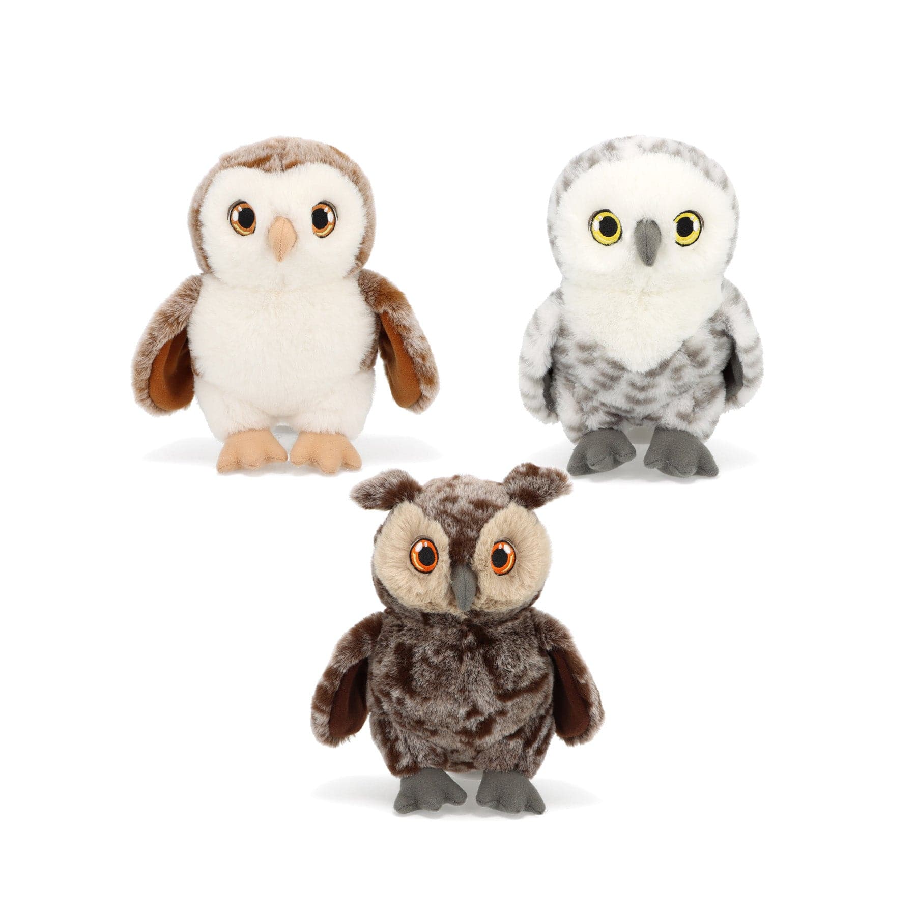 Plush owl toys trio, cute stuffed animal collection, white and brown soft toy owls with big eyes, children's cuddly plushies, isolated on white background.