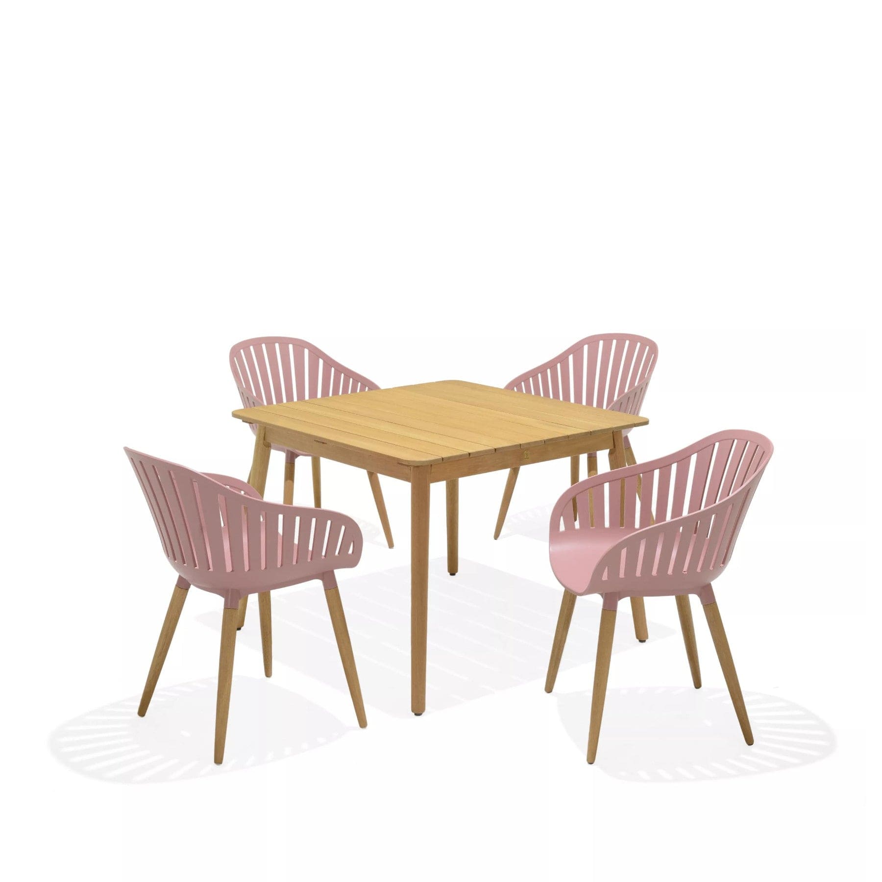 Modern wooden dining table with pink chairs in a minimalist setting