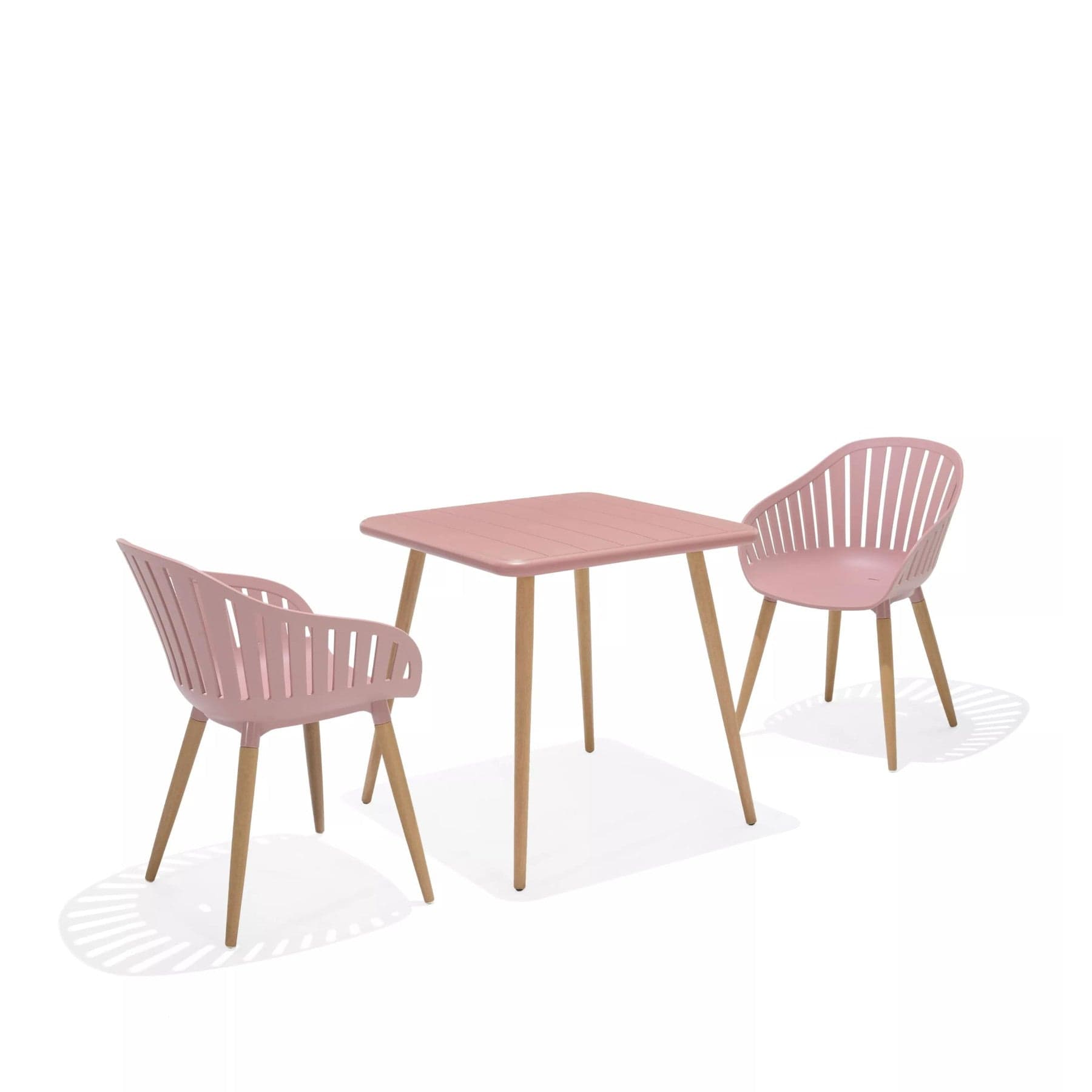 Modern pink dining table and chairs set with wooden legs, minimalist furniture design, isolated on white background