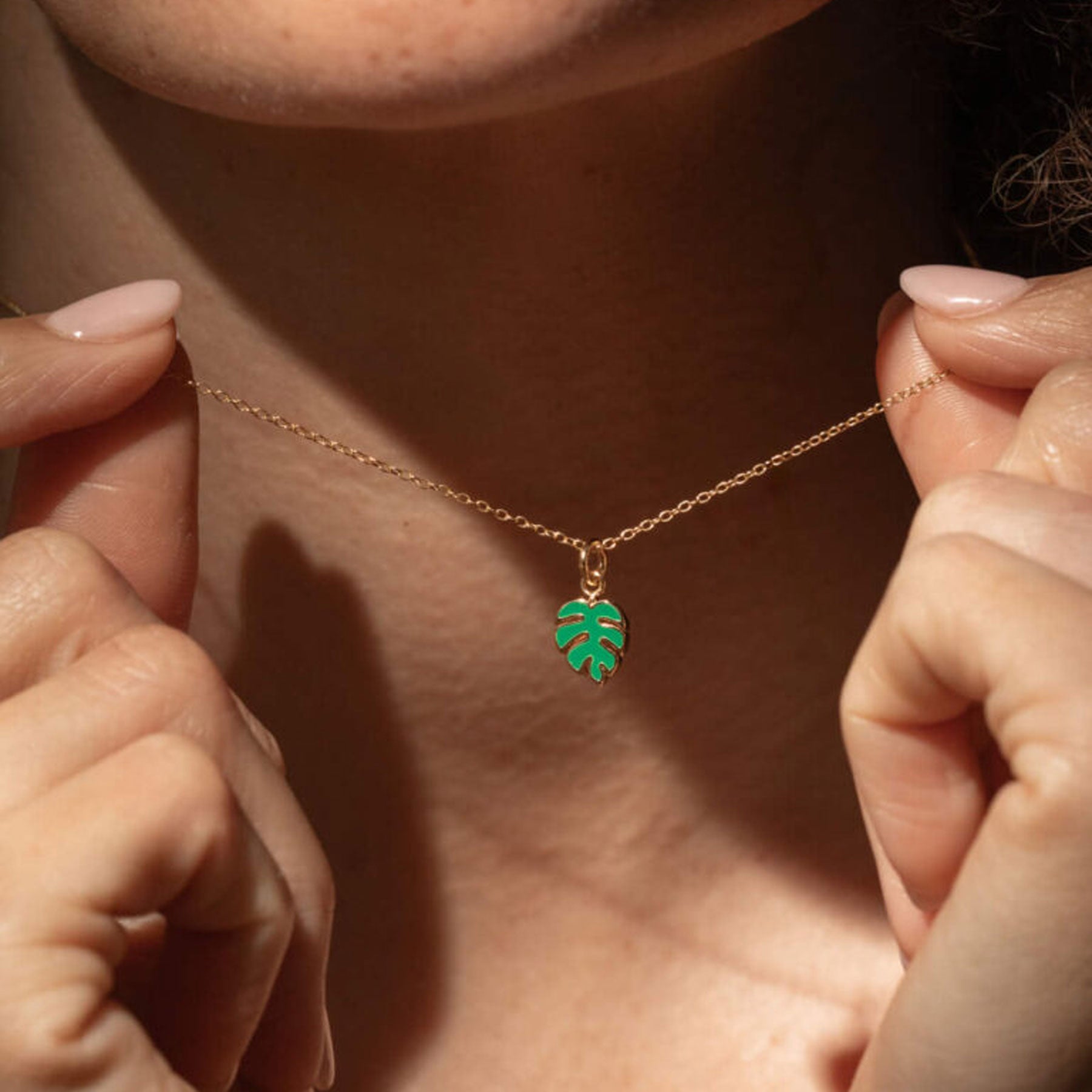 Gold monstera enamel necklace