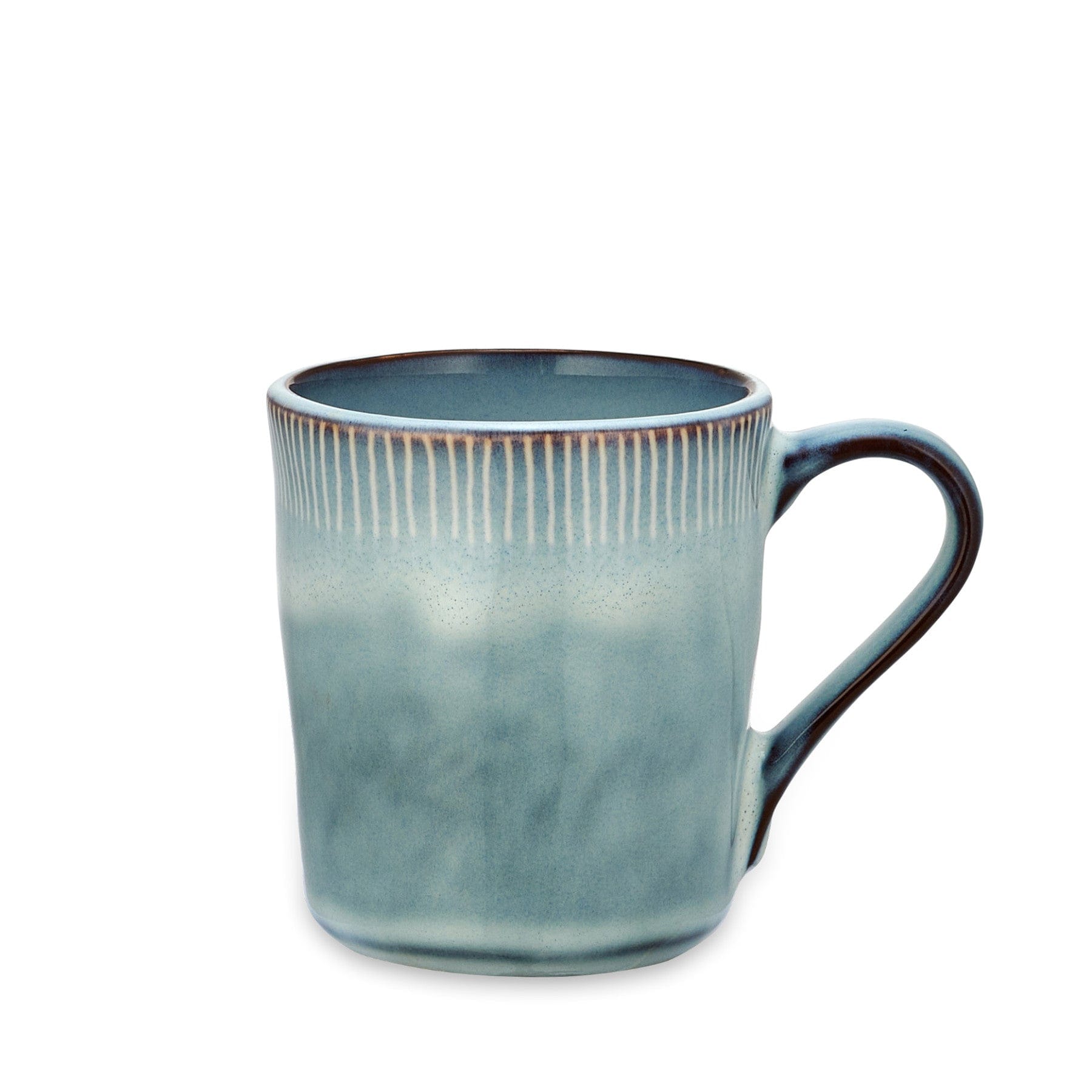 Ceramic blue mug with handle on white background, glazed stoneware coffee cup with vertical ridges design.