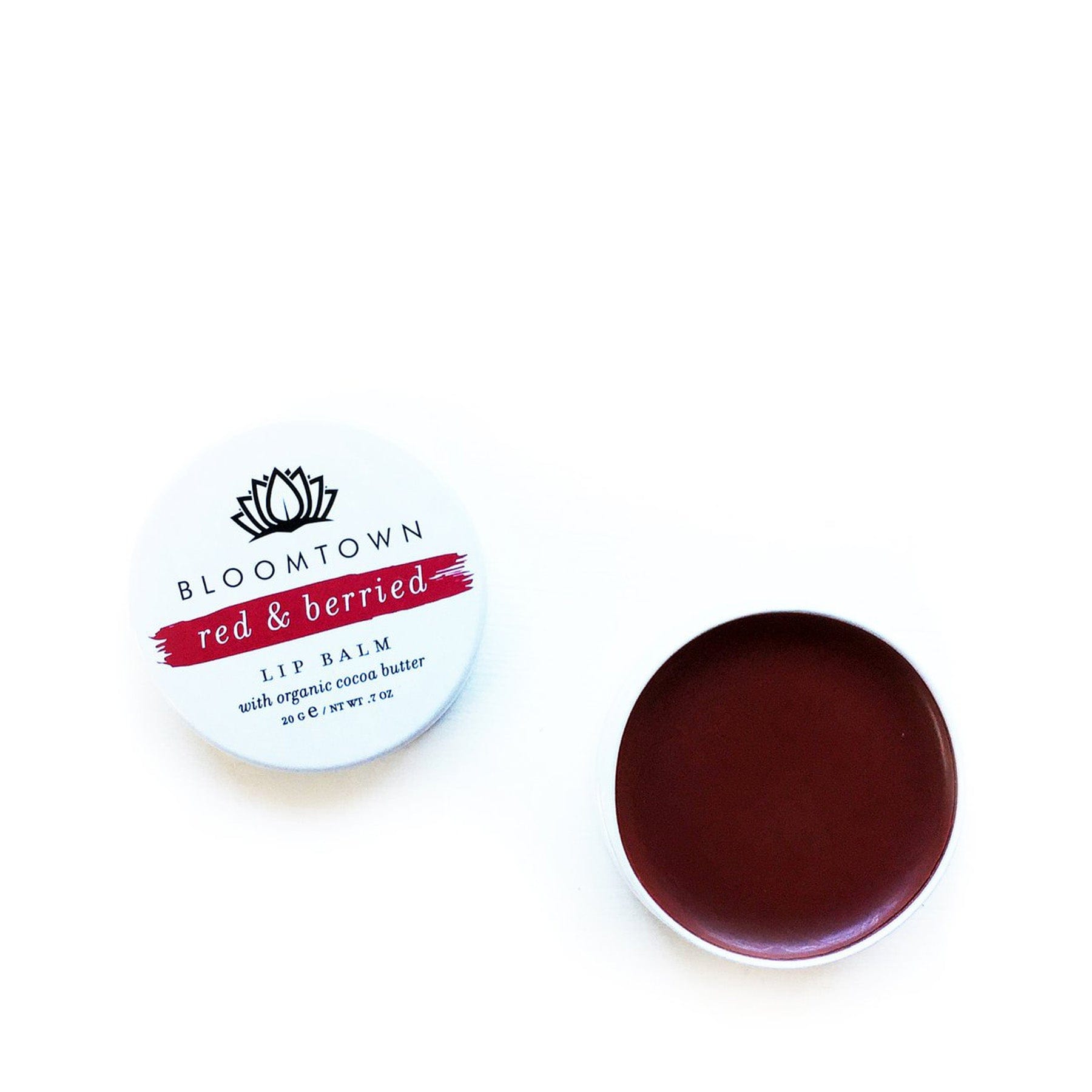 Bloomtown Red & Berried Lip Balm with organic cocoa butter tin on white background, top view of open lip care product