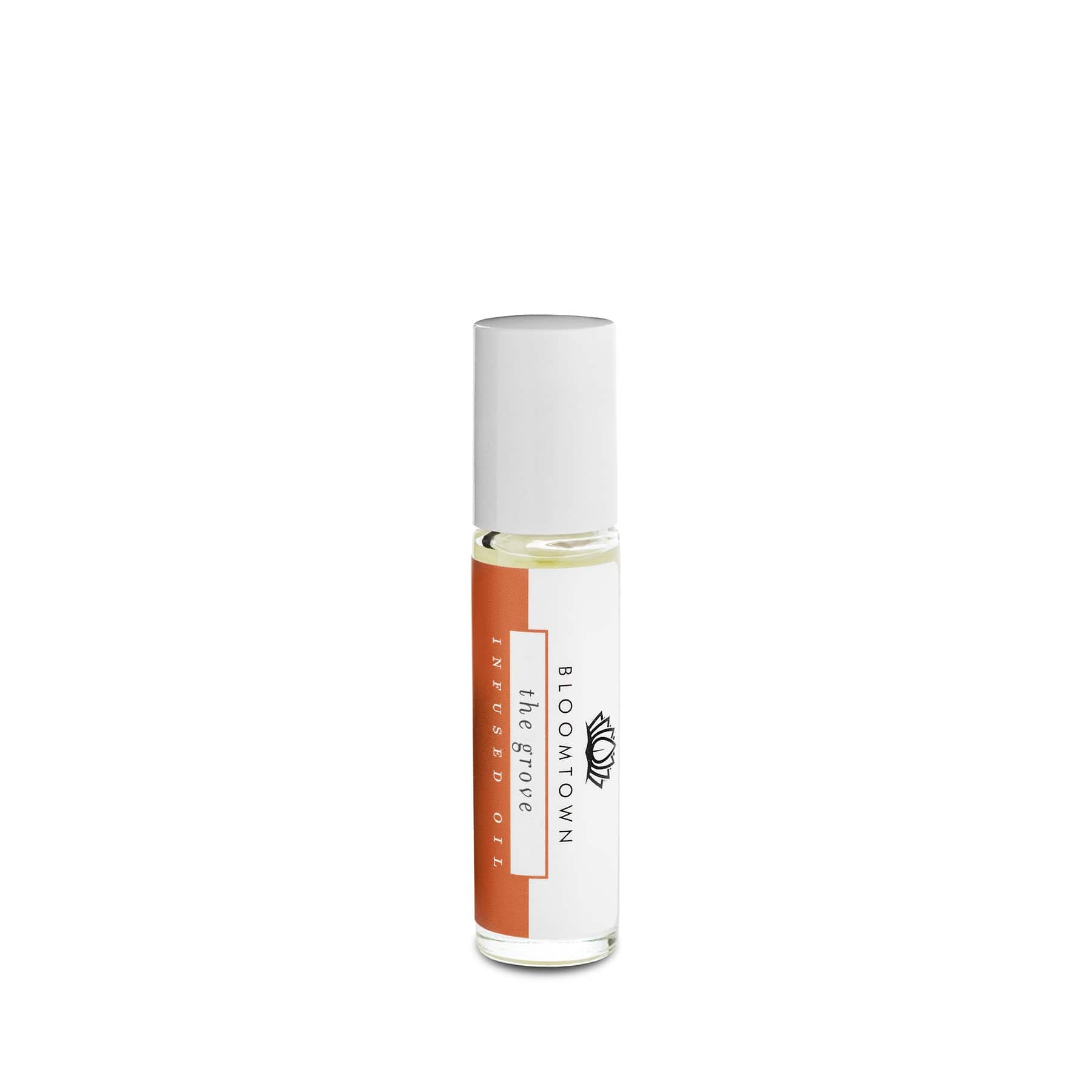 Roll-on fragrance oil in clear glass vial with white cap and orange label, isolated on white background.