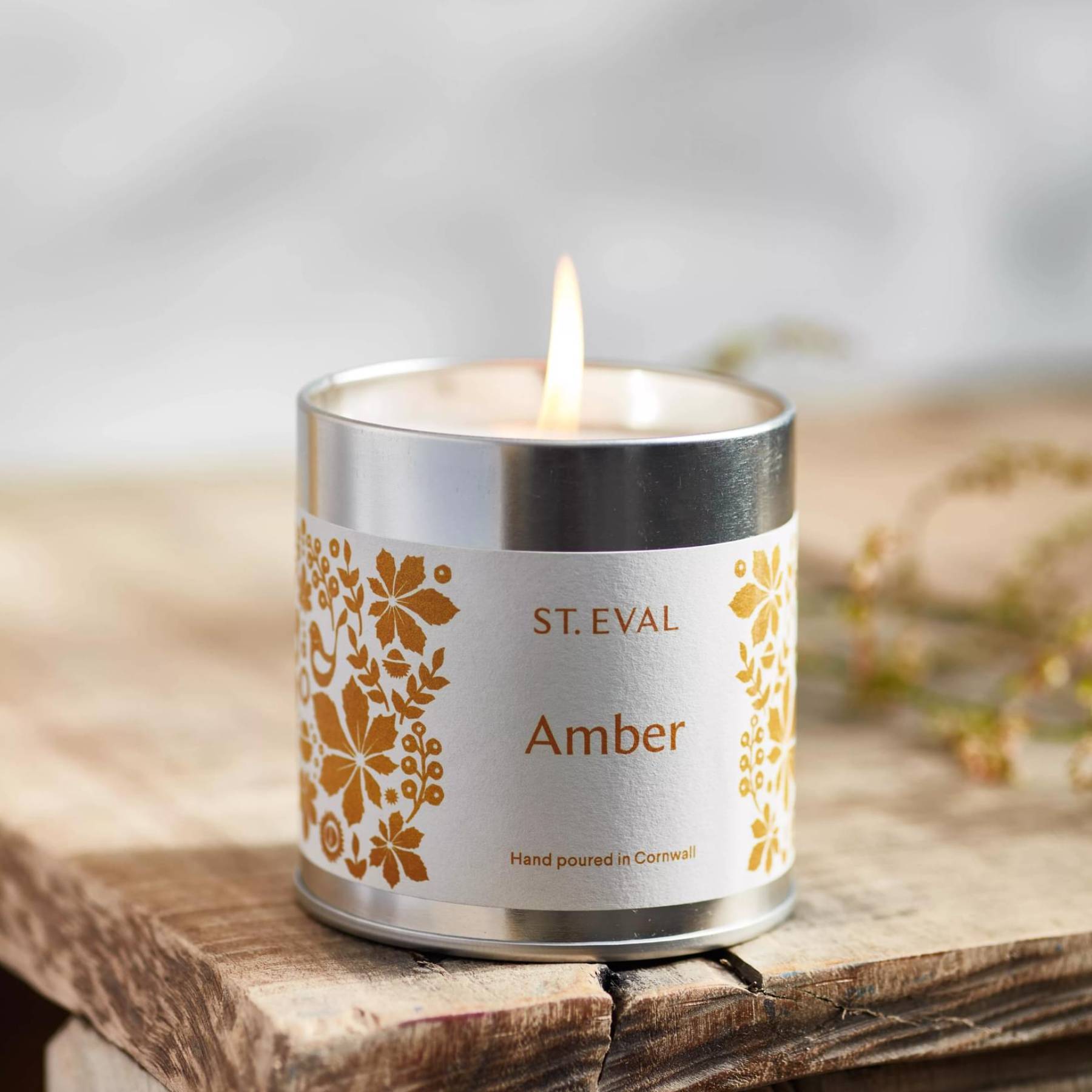 Amber scented tin candle