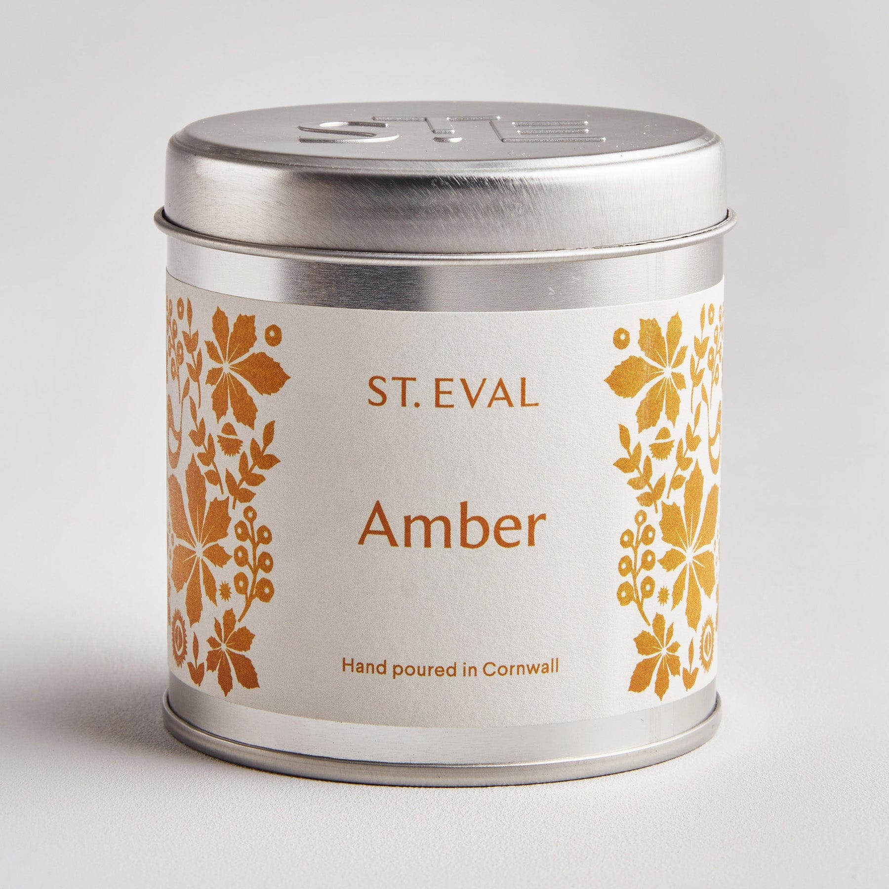 Amber scented tin candle