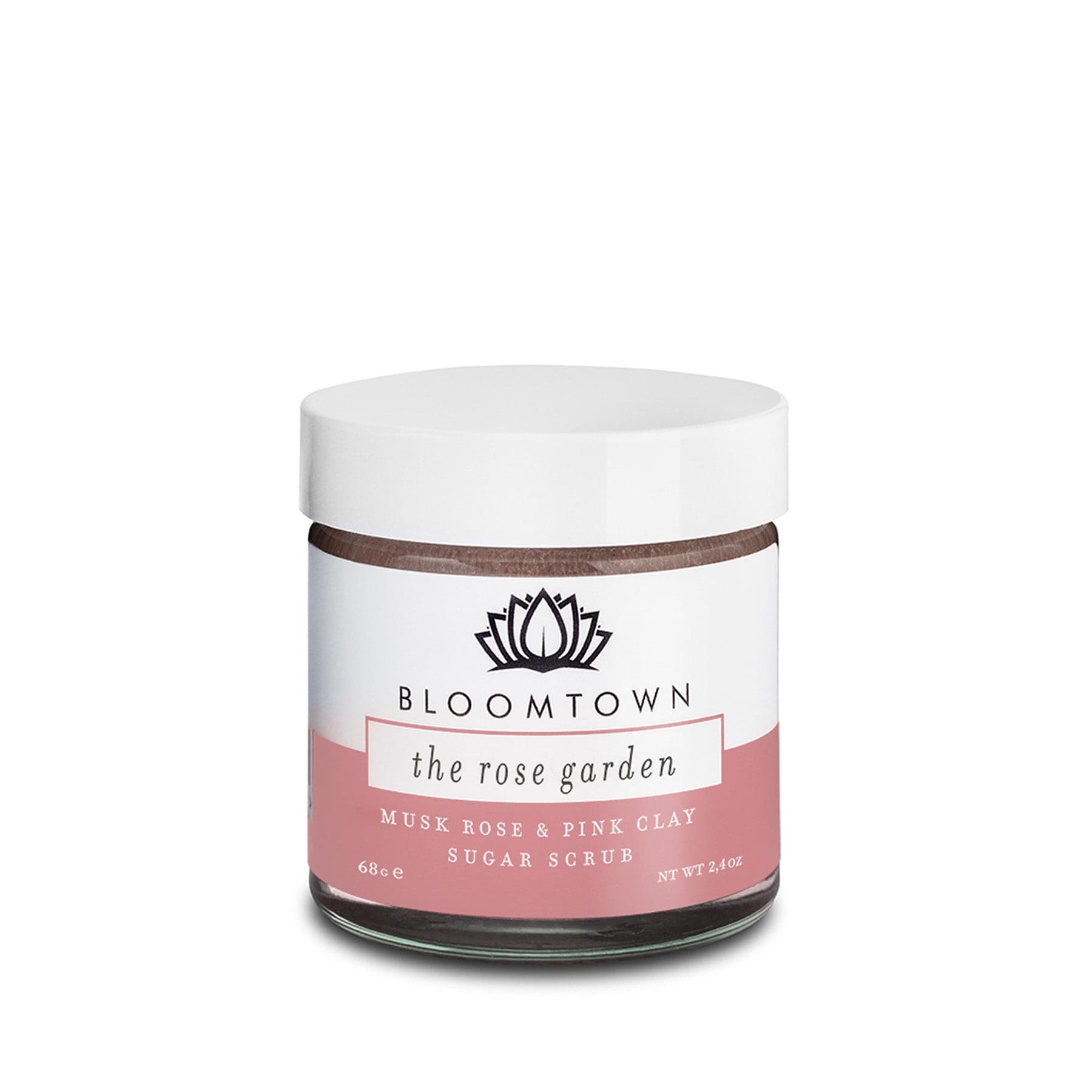 Bloomtown The Rose Garden sugar scrub with musk rose and pink clay in white jar on isolated background.