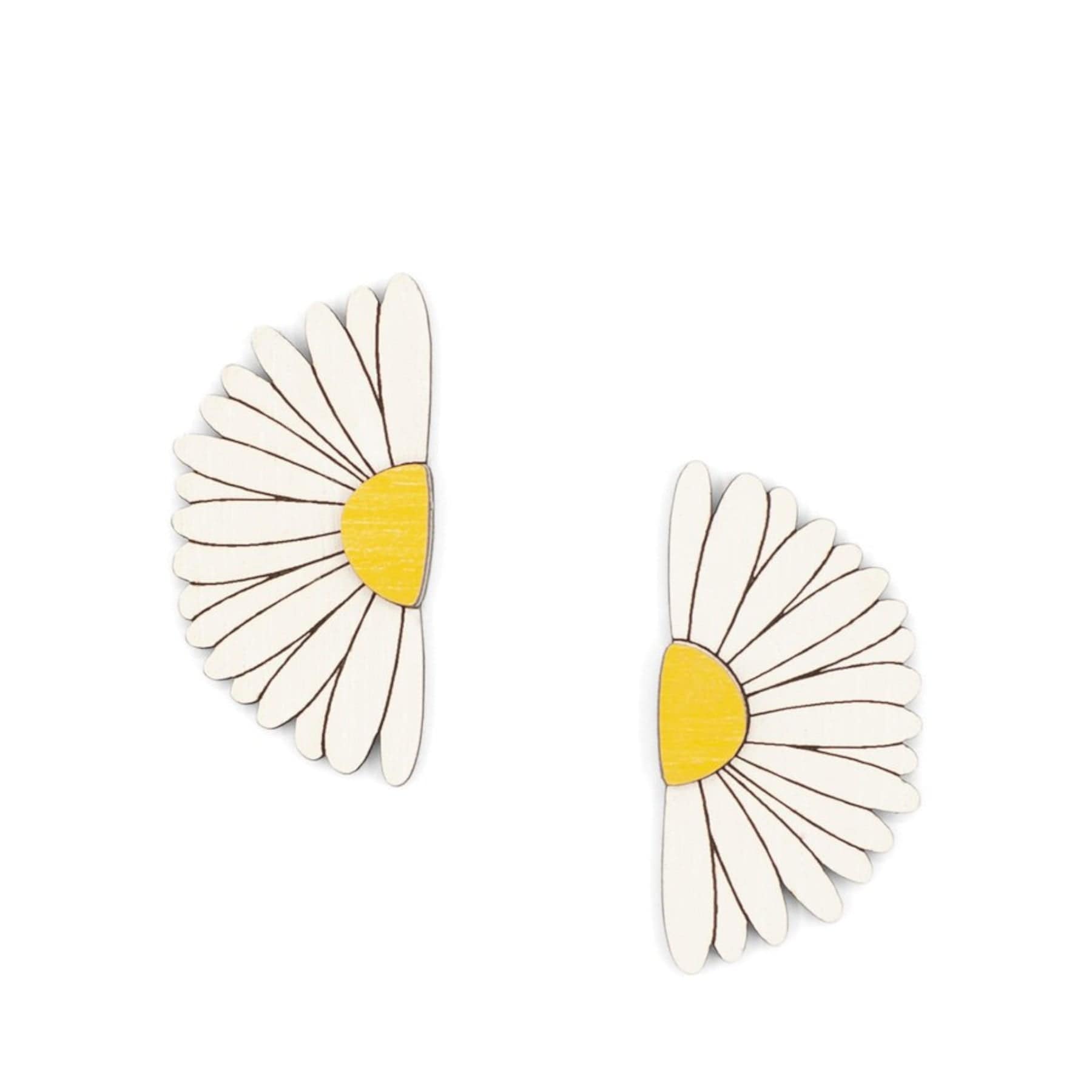 White and yellow daisy-shaped earrings isolated on white background
